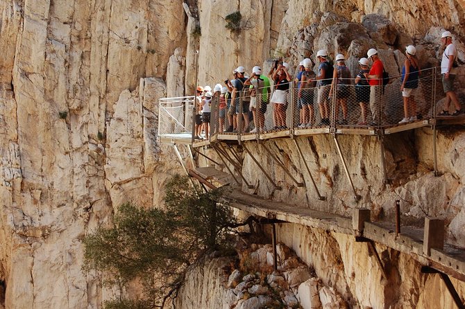 From El Chorro: Caminito del Rey - Guided safety on the narrow walk: helmets, rules, and calm pacing
