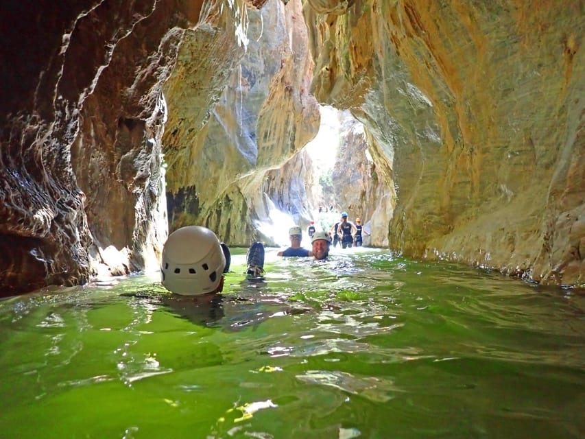 From Marbella: Guadalmina River Guided Canyoning Adventure - Swimming pools, slides, and optional jumps through the narrow canyon