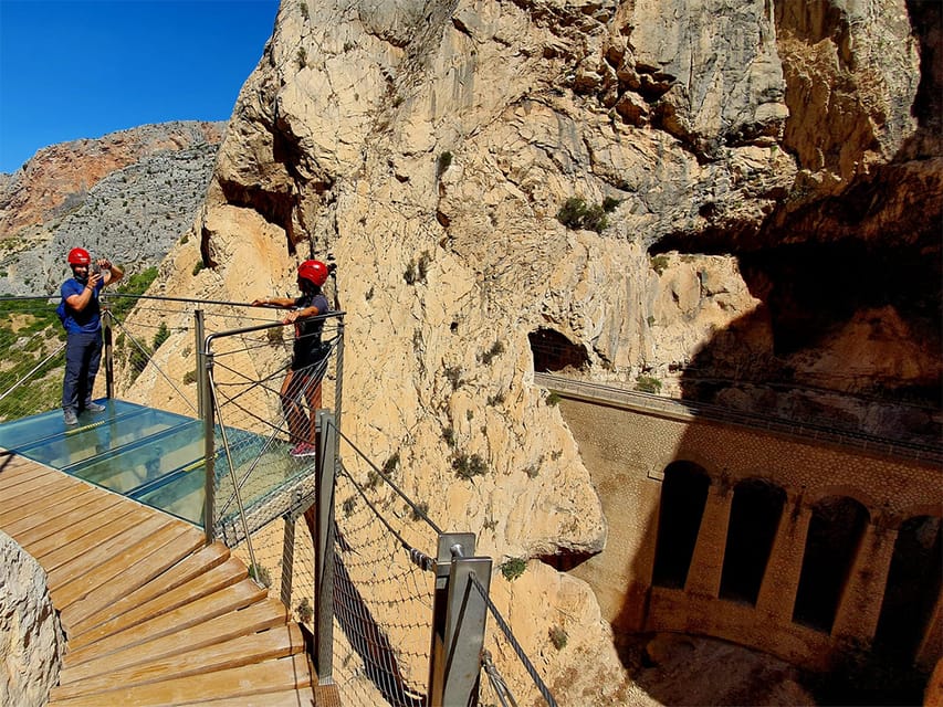 Walkers on the glass-floored balcony above the gorge