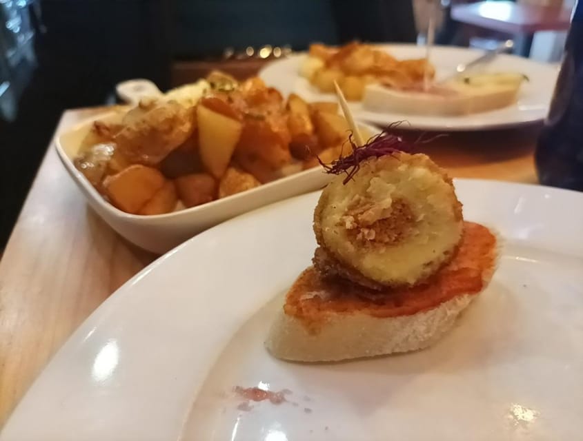 Malaga: Food Tour with Local Guide, Tapas, and Drinks - Seafood Staples: Pescadito Frito, Boquerones, and Pulpo Pincho