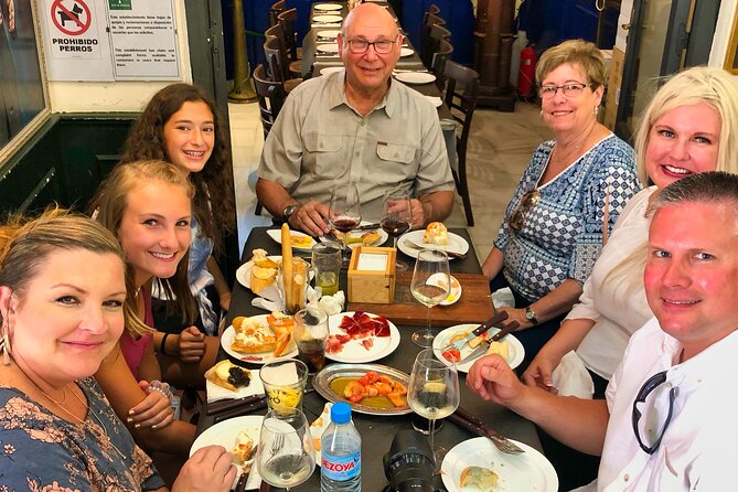 Malaga Food Walking Tour with Atarazanas Market Visit - What the guide actually does for your experience