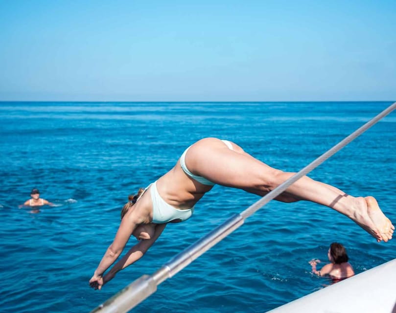 Malaga: Sailing Catamaran with Swimming and Paella Lunch - Welcome drink, choosing your sun spot, and how the boat works