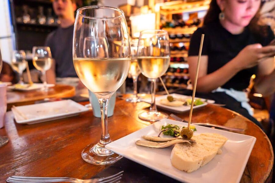 Malaga: Wine and Tapas Tour with Tastings and Drinks - Stop one in Malaga, classic tapas plus a warm-up walk