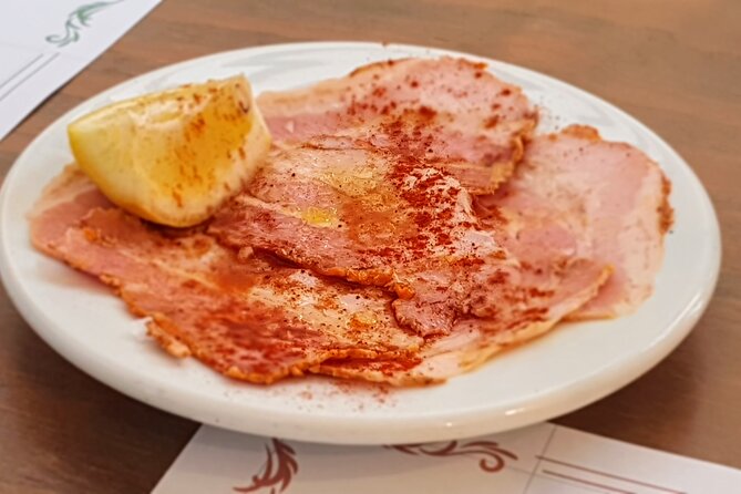 Taste of Malaga Tour : Tapas, History and Local Customs - Ultramarinos at Plaza Enrique Garcia Herrera 8: ham, cold cuts, and vermouth